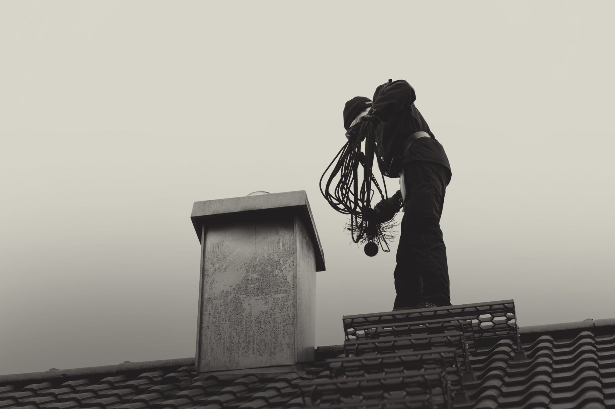 man working on a chimney